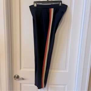 Ecru  Navy Blue with burnt orange and cream stripes down sides.  Size 10